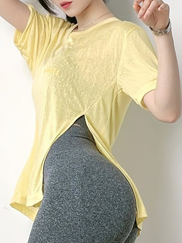 Stylish yellow cropped sports top for women with side cut, perfect for yoga, made of breathable Nylon and Spandex. Model wearing in profile.